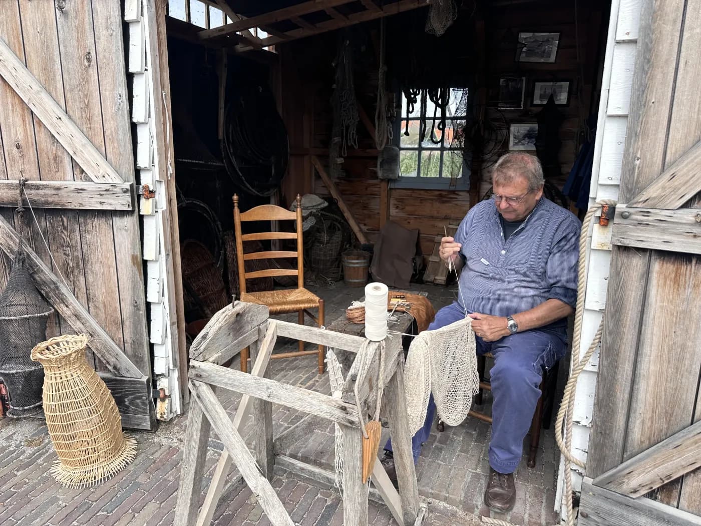 Traditional craftsman demonstrating net-making