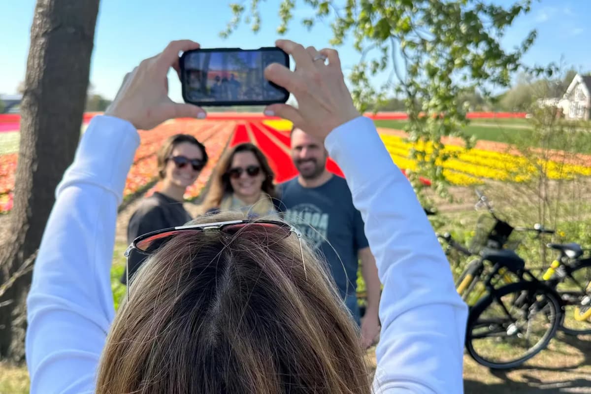 Self-guided cyclists exploring tulip fields