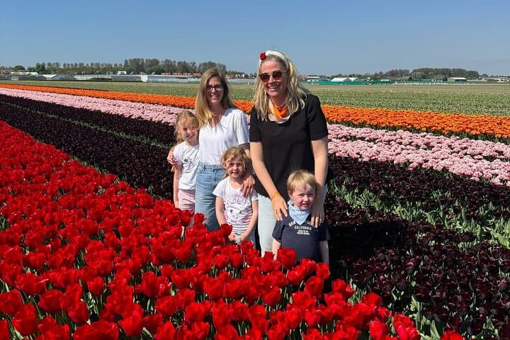 Family in tulip field during bike tour