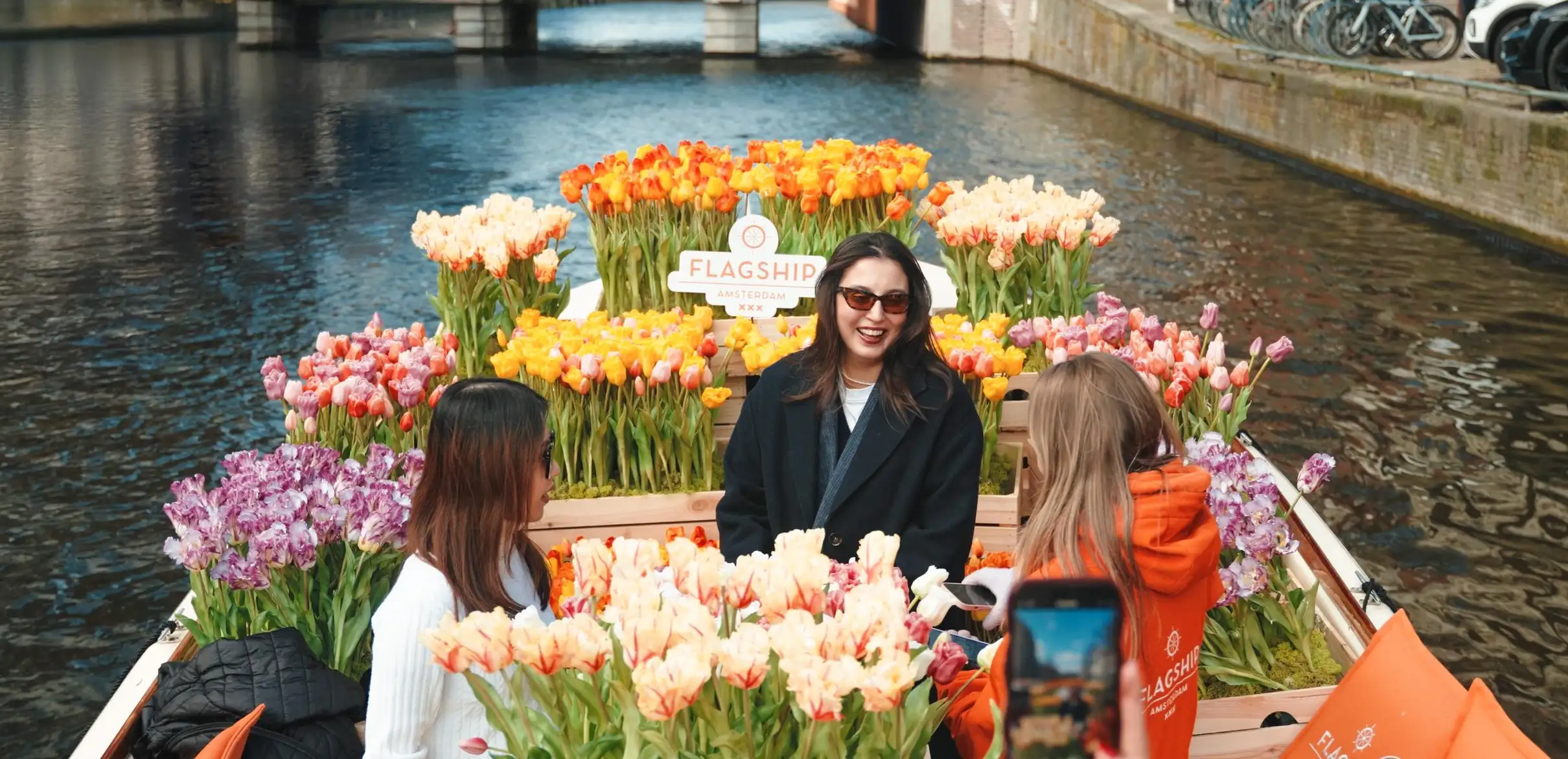 Small group of guests enjoying the Amsterdam tulip boat canal cruise