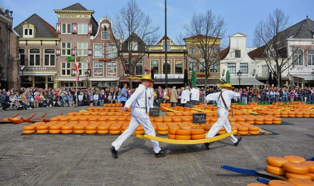 Traditional cheese carriers at a Dutch cheese market